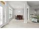 Open-concept home with dining area featuring a chandelier, views into the living room, and lots of natural light at 6680 Sw 179Th Court Rd, Dunnellon, FL 34432