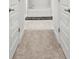 Hallway view of the en suite main bathroom with a hallway runner at 6680 Sw 179Th Court Rd, Dunnellon, FL 34432