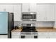 Contemporary kitchen featuring stainless steel appliances and ample counter space at 6680 Sw 179Th Court Rd, Dunnellon, FL 34432