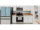 Modern kitchen with stainless steel appliances and white cabinetry at 6680 Sw 179Th Court Rd, Dunnellon, FL 34432