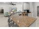 Spacious kitchen featuring barstool seating and flows to the living space at 6680 Sw 179Th Court Rd, Dunnellon, FL 34432
