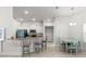 Modern kitchen with stainless steel appliances, breakfast bar, and adjacent dining area at 6680 Sw 179Th Court Rd, Dunnellon, FL 34432