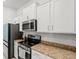 Well-appointed kitchen with stainless steel appliances and beautiful countertops at 6680 Sw 179Th Court Rd, Dunnellon, FL 34432