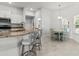 Well-equipped kitchen with granite countertops, barstool seating and eating area nearby at 6680 Sw 179Th Court Rd, Dunnellon, FL 34432
