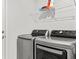 Laundry room equipped with modern appliances and wire shelving for added storage at 6680 Sw 179Th Court Rd, Dunnellon, FL 34432