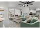 Open floor plan living room with bright furniture, tile flooring, ceiling fan and recessed lighting at 6680 Sw 179Th Court Rd, Dunnellon, FL 34432