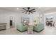 Bright, open living room featuring tile floors and comfortable seating near the dining area at 6680 Sw 179Th Court Rd, Dunnellon, FL 34432