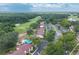 Scenic aerial shot showcasing the property's location along golf course near community pool and lake at 688 Midway Dr # B, Ocala, FL 34472