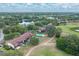 Bird's eye view of complex near lake and golf course with a communal pool area at 688 Midway Dr # B, Ocala, FL 34472