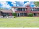 Spacious backyard with lush green lawn and a patio area, perfect for outdoor enjoyment at 688 Midway Dr # B, Ocala, FL 34472