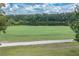 Picturesque view of the tranquil lake surrounded by lush trees and greenery at 688 Midway Dr # B, Ocala, FL 34472