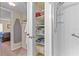 Bathroom with a stand-up shower and a built-in linen closet for towels and toiletries at 688 Midway Dr # B, Ocala, FL 34472