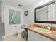 Bathroom featuring tile floors, granite counters, and decorative art at 688 Midway Dr # B, Ocala, FL 34472