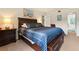 Comfortable bedroom with furniture, neutral colored walls and carpet for a clean space at 688 Midway Dr # B, Ocala, FL 34472