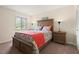 Bedroom featuring neutral walls, a large bed, and wood furnishings at 688 Midway Dr # B, Ocala, FL 34472