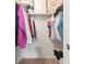 Walk-in closet with shelving, hanging clothes, boxes, and shoes for plenty of storage at 688 Midway Dr # B, Ocala, FL 34472
