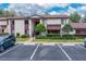 Attractive two-story condo with a parking lot, a walkway and landscaping in a well-maintained community at 688 Midway Dr # B, Ocala, FL 34472