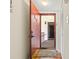 Open front door reveals a glimpse of the interior with wood floors and staircase at 688 Midway Dr # B, Ocala, FL 34472