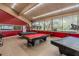 Community game room featuring three pool tables beneath unique lighting at 688 Midway Dr # B, Ocala, FL 34472