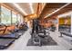 Community gym featuring treadmills and weight-lifting equipment with views from the large, bright windows at 688 Midway Dr # B, Ocala, FL 34472