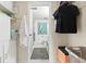 Hallway with closet that leads into a bathroom with a shower at 688 Midway Dr # B, Ocala, FL 34472