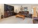 Comfortable living room features a large flat-screen television and a plush leather sofa set at 688 Midway Dr # B, Ocala, FL 34472