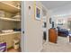 Pantry with plentiful shelving and adjacent living area featuring modern furnishings at 688 Midway Dr # B, Ocala, FL 34472