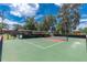 Outdoor community area featuring a pickleball court with shelter and playground equipment for a Gathering day at 688 Midway Dr # B, Ocala, FL 34472