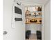 Storage space featuring a ladder, shelves, and room for storing tools at 688 Midway Dr # B, Ocala, FL 34472