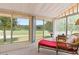 Sunroom with multiple windows and views of the lush green landscape at 688 Midway Dr # B, Ocala, FL 34472