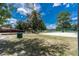 Outdoor recreational area featuring a volleyball court, playground, picnic shelter, and lush green landscape at 688 Midway Dr # B, Ocala, FL 34472