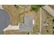 Aerial view showcases a well-maintained property with mature landscaping and a concrete driveway at 7 Pecan Drive Ter, Ocala, FL 34472