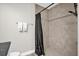 Bathroom features a shower with tan tile and a black shower curtain at 7 Pecan Drive Ter, Ocala, FL 34472