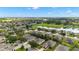 Beautiful aerial shot of a residential community surrounded by nature and serene lake at 7263 Sw 99Th Cir, Ocala, FL 34481