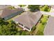 Aerial view of the home highlighting a screened lanai and mature landscaping in a residential community at 7263 Sw 99Th Cir, Ocala, FL 34481