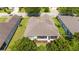 Aerial view of the home showing a screened-in lanai and well-maintained landscaping in a residential neighborhood at 7263 Sw 99Th Cir, Ocala, FL 34481
