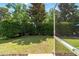 Landscaped backyard with trimmed hedges offering additional privacy at 7263 Sw 99Th Cir, Ocala, FL 34481