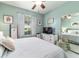 Bedroom with a ceiling fan, accent wall, chest of drawers and mirror closet doors at 7263 Sw 99Th Cir, Ocala, FL 34481