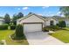 Desirable single-story property with a 2-car garage, well-maintained lawn, and attractive landscaping at 7263 Sw 99Th Cir, Ocala, FL 34481