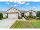 Lovely single-story residence with a two-car garage, manicured lawn, and an inviting facade at 7263 Sw 99Th Cir, Ocala, FL 34481