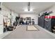 Organized garage space with storage cabinets, work area, and ample room for vehicles and projects at 7263 Sw 99Th Cir, Ocala, FL 34481