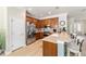 This modern kitchen includes stainless steel appliances, tile backsplash and a breakfast bar area at 7263 Sw 99Th Cir, Ocala, FL 34481