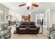 Comfortable living room with open layout, seamlessly connecting to the dining and kitchen areas for easy entertaining at 7263 Sw 99Th Cir, Ocala, FL 34481