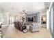 Bright and airy living room with hardwood floors, comfortable seating, and easy access to other living spaces at 7263 Sw 99Th Cir, Ocala, FL 34481