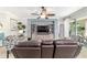 Spacious living room with plush seating, stylish decor, and a large window offering plenty of natural light at 7263 Sw 99Th Cir, Ocala, FL 34481