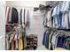 Walk-in closet with metal shelving and clothing rods for optimal storage at 7263 Sw 99Th Cir, Ocala, FL 34481