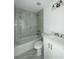 Modern bathroom with a tub and shower combo and vanity with stone counter at 7292 Hemlock Loop, Ocala, FL 34472