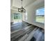 Light-filled dining room featuring wood-look floors and sliding doors to the backyard at 7292 Hemlock Loop, Ocala, FL 34472
