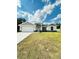 Charming single-story home with a manicured lawn and attached two car garage at 7292 Hemlock Loop, Ocala, FL 34472