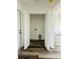 Convenient laundry room featuring wood-look floors and a dedicated laundry area at 7292 Hemlock Loop, Ocala, FL 34472